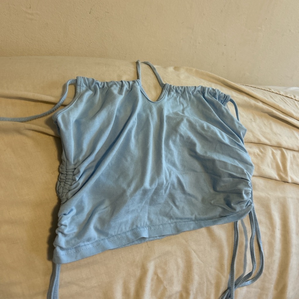 Blue crop top it is a L but if ur heavy chested it will be shorter